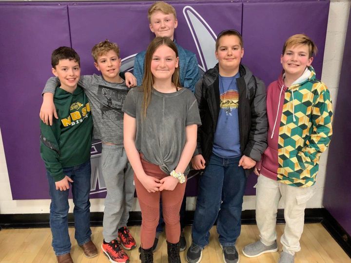 5th grade math track meet students in front of purple pads in gym 