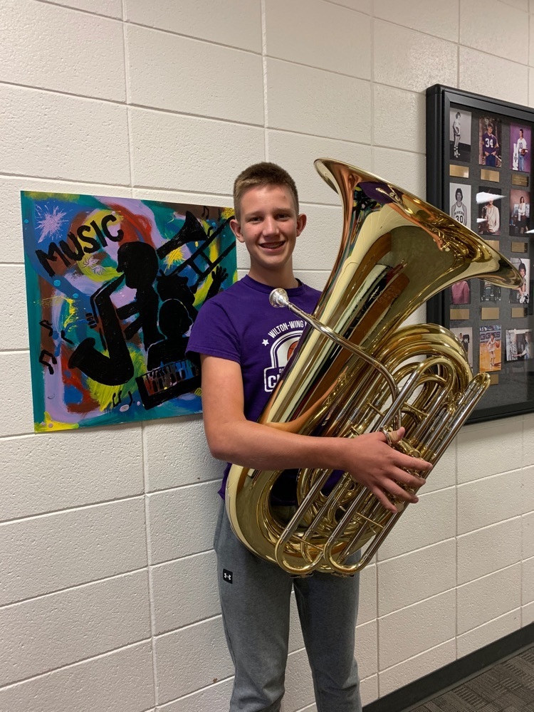 student holding new tuba