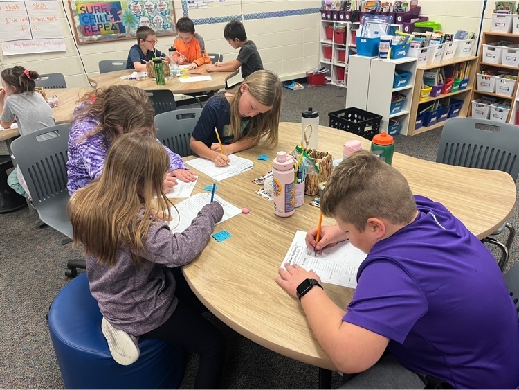 3rd grade working on papers